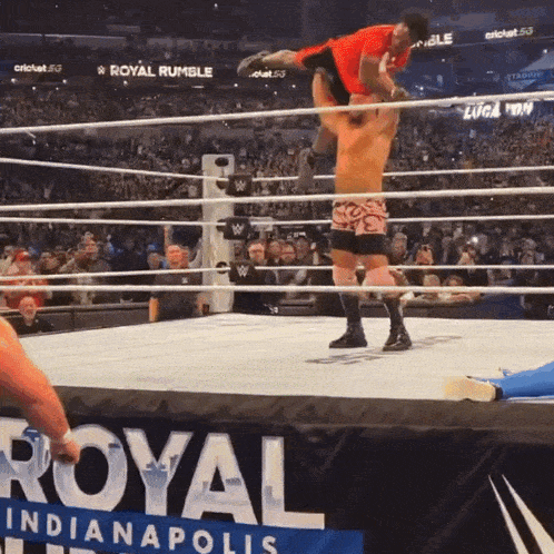 a wrestling match is taking place at the royal rumble