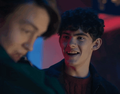two young men are talking to each other and one of them is saying oh my god say it again