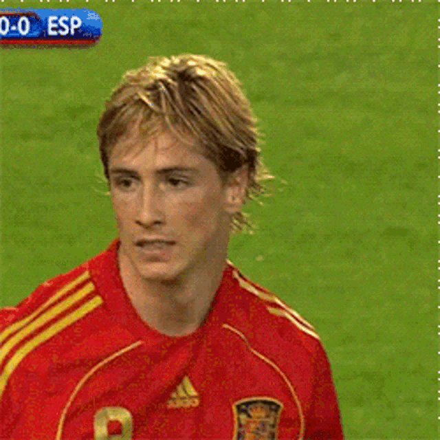 a soccer player wearing a red jersey with the number 9