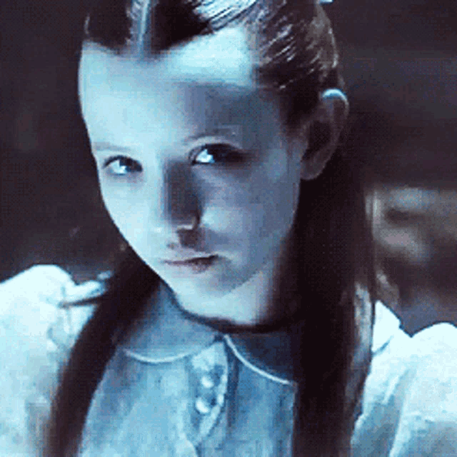 a close up of a young girl with long hair