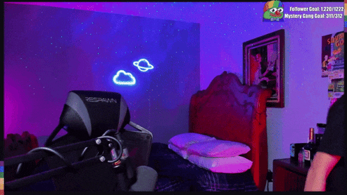 a spawn gaming chair is sitting in a bedroom