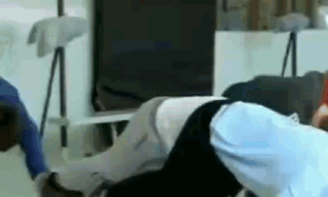 a group of people are laying on the floor in a room .