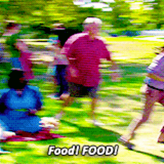 a blurry picture of people in a park with the words food ! food ! above them