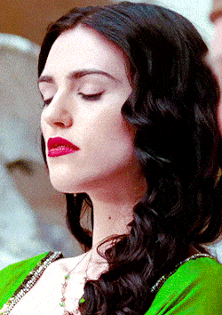 a close up of a woman 's face with red lips