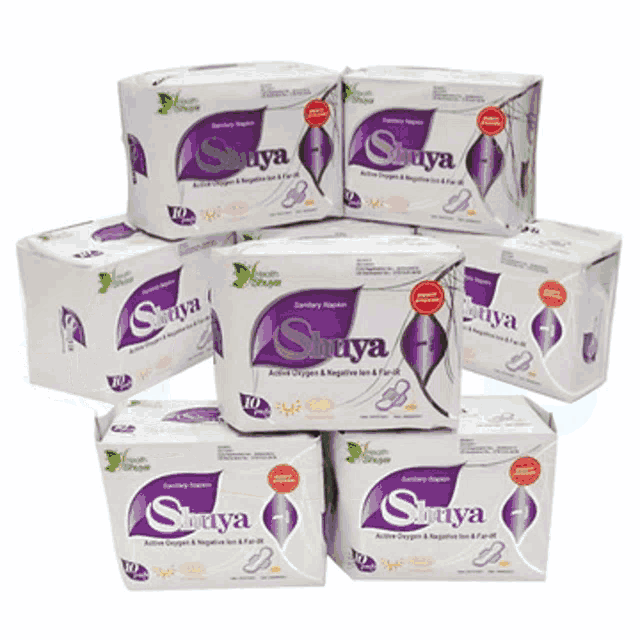 several boxes of suriya sanitary pads stacked on top of each other