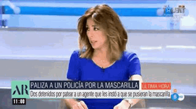 a woman in a blue shirt is on a news channel