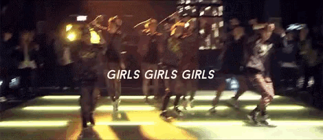a group of girls are dancing in a dark room with the words girls girls girls written on the bottom