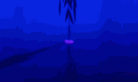 a close up of a cartoon character 's face with a purple background and a blue background .