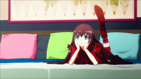 a girl laying on her stomach with her legs crossed