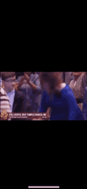 a man in a blue shirt is standing in a crowd with a sign that says full gospel not temple discipline inc