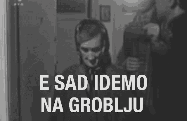 a black and white photo with the words e sad idemo na groblju in white letters