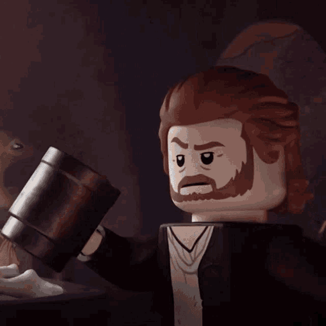 a lego man with a beard is holding a hammer