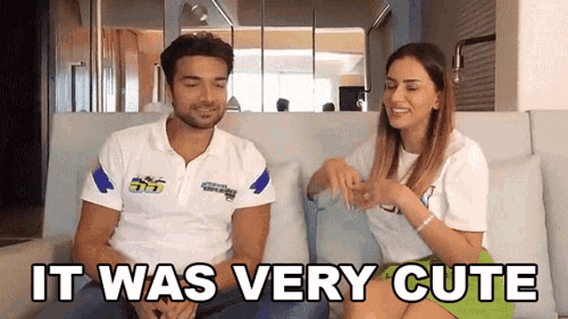 a man and a woman sitting on a couch with the words it was very cute