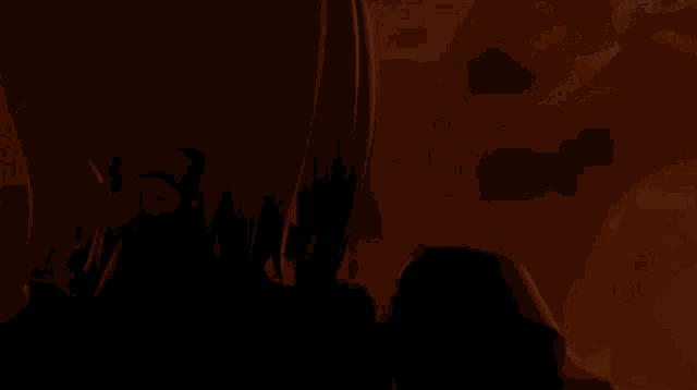 a close up of a person 's face in the dark