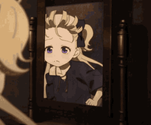 a little girl with blonde hair and purple eyes looks at herself in a mirror