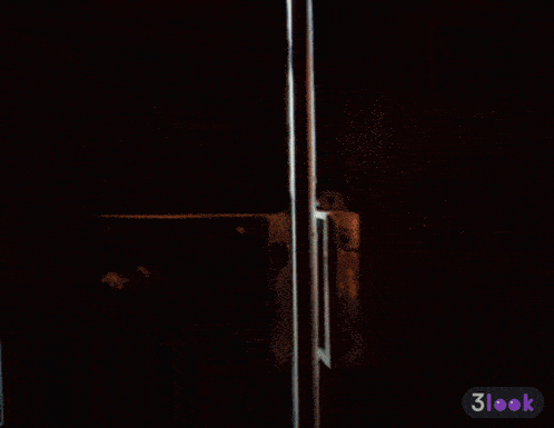 a man in a suit and tie is standing in a doorway with a 3look icon in the corner