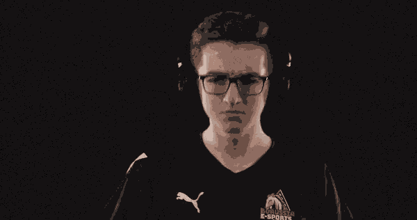 a man wearing headphones and a black puma shirt