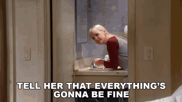a woman in a bathroom with the words tell her that everything 's gonna be fine on the bottom
