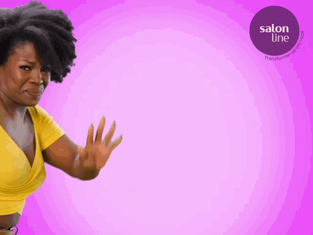 a woman in a yellow shirt is waving her hand in front of a purple salon line logo