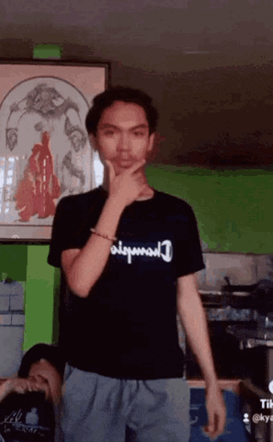 a man wearing a black shirt that says disposal