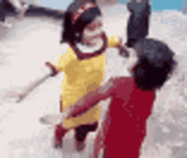 a boy and a girl are hugging each other .
