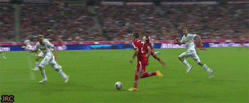 a soccer player with the number 7 on his jersey kicks the ball