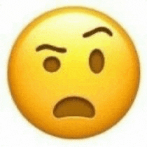 a close up of a yellow smiley face with a surprised look on its face .