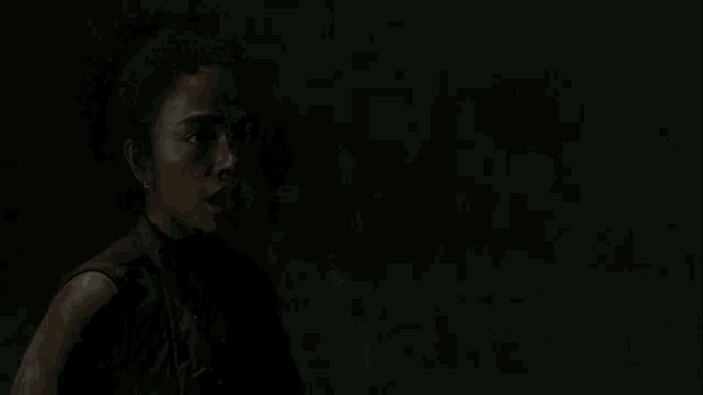 a young man with a tear running down his face is crying .