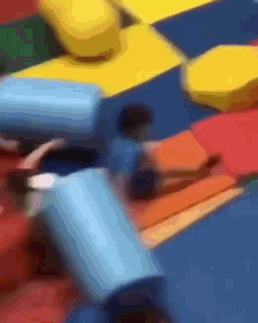 a blurred image of a bunch of different colored blocks