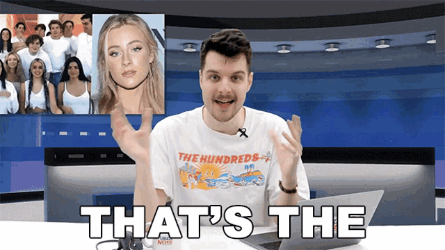 a man wearing a t-shirt that says the hundreds on it