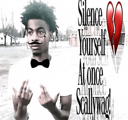a man with a mustache is wearing a white shirt that says silence yourself at once scallywad