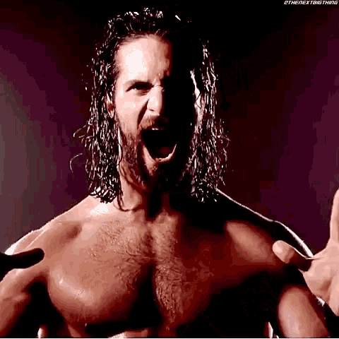 a man with long hair and a beard is without a shirt and is screaming .