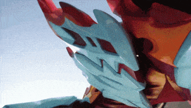 a close up of a person 's arm with a blue and red glove on