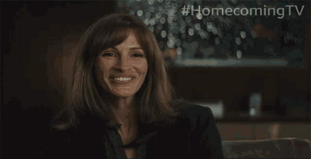 a woman is smiling and saying oh no in a homecoming tv advertisement