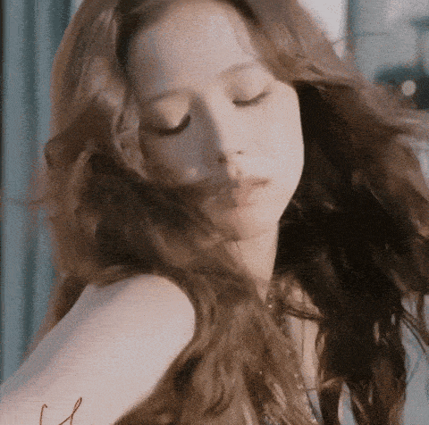 a close up of a woman with her eyes closed