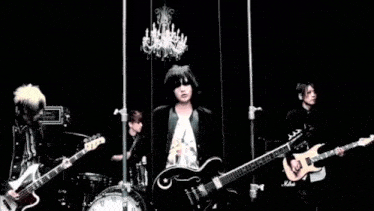 a man playing a guitar in front of a marshall amplifier