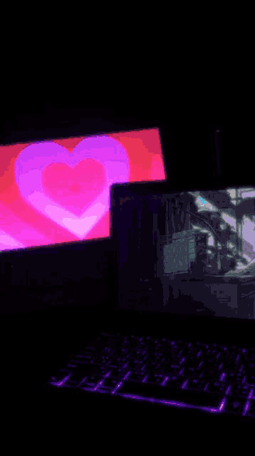 a computer monitor with a heart on it
