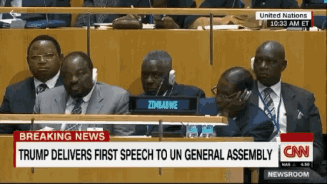 a group of men sitting in a united nations assembly