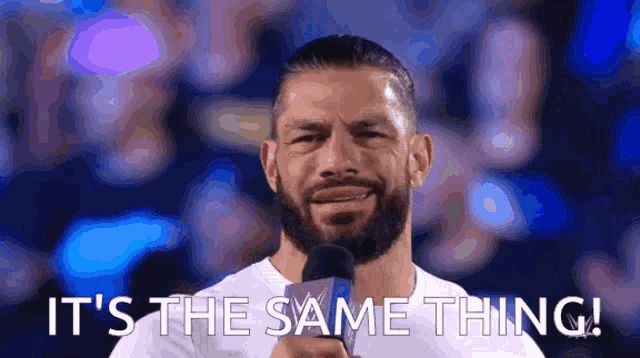 a man holding a microphone with the words it 's the same thing behind him