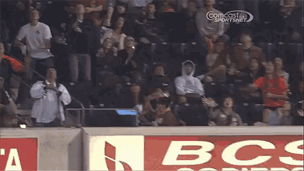 a crowd of people watching a game on nbc