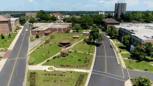 an aerial view of a city with lots of buildings and trees