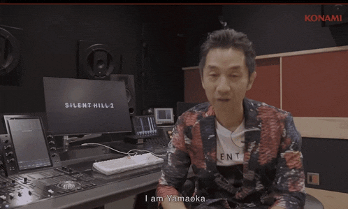 a man is sitting in front of a computer screen that says silent hill 2