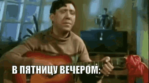 a man is playing a guitar in a living room with a foreign language on the screen .