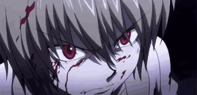 a close up of a person 's face with blood coming out of their eyes .
