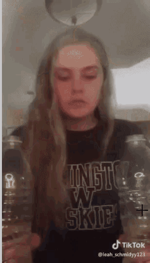 a girl wearing a t-shirt that says ingto w skie