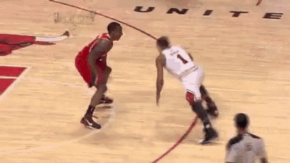 two basketball players are playing a game of basketball on a basketball court .