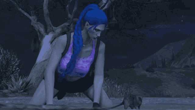 a woman with blue hair kneeling in the water