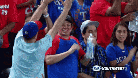 a crowd of people watching a baseball game with a fox southwest logo in the corner