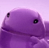 a close up of a purple jellyfish with black eyes .