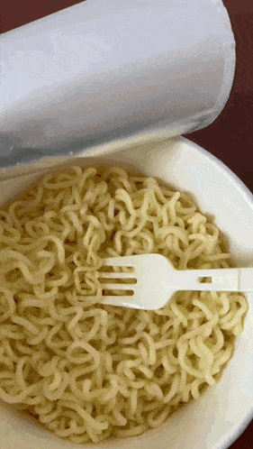 a bowl of ramen with a fork in it